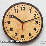 Wanduhr „TinyDottie“ mit Intarsien aus Räuchereiche und einem Rand aus Nussbaum Wanduhr „TinyDottie“ mit Intarsien aus Räuchereiche und einem Rand aus Nussbaum